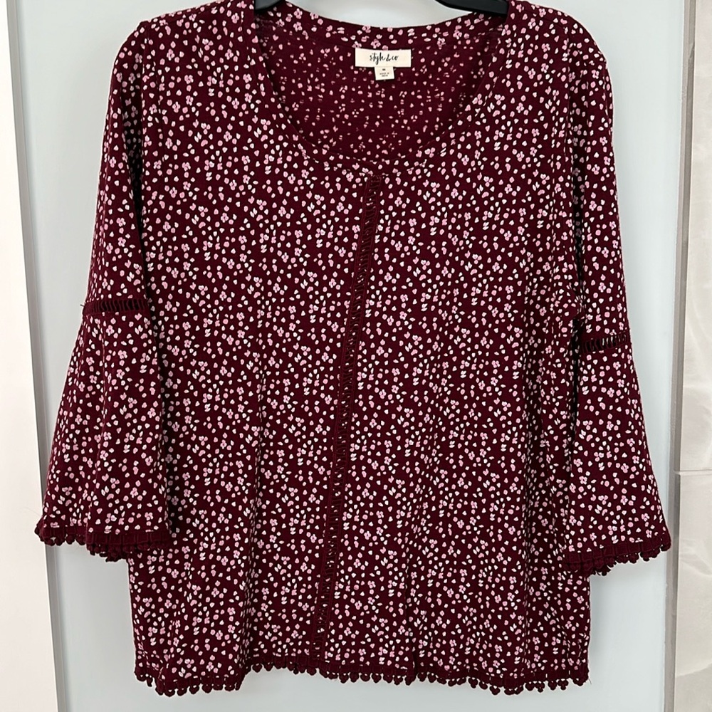 Size M embroidery trimmed blouse with flare sleeves.